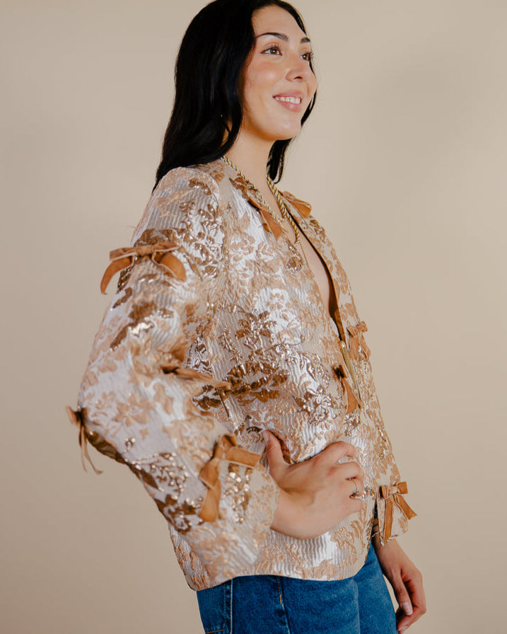 Sandhya Garg Agra gold jacquard jacket close view — front open construction and velvet bow details visible on gold woven jacquard fabric