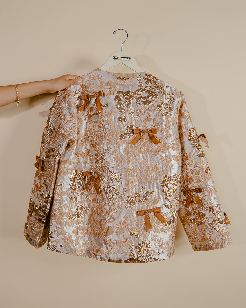 Sandhya Garg Agra gold jacquard jacket styled for party or evening occasion — showing how loose open-front jacket layers over occasion wear
