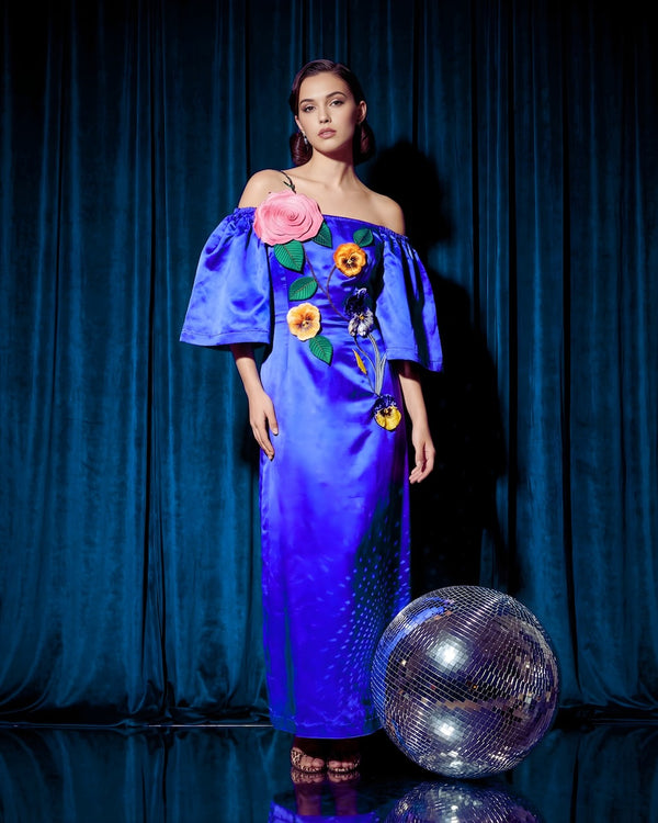 Handcrafted embroidery detail on royal blue off-shoulder maxi dress by Sandhya Garg — artisan floral stitching on viscose linen satin
